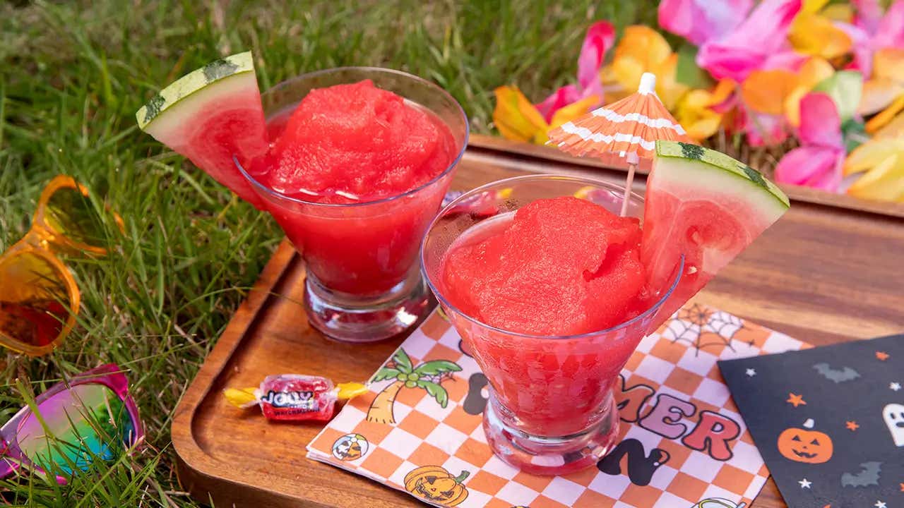 watermelon slushies on cutting board on the grass