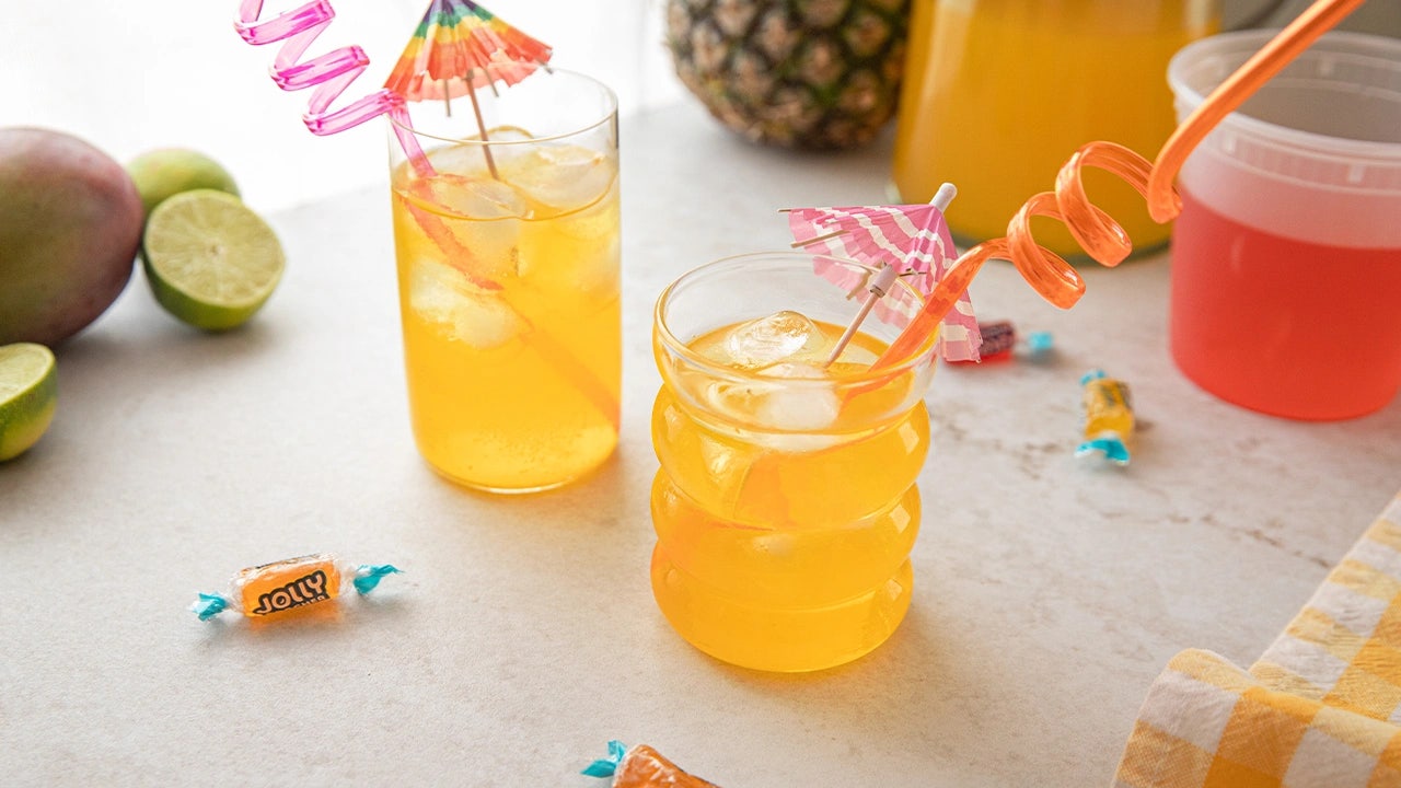 pair of jolly rancher homemade sodas with spiral straws and umbrellas