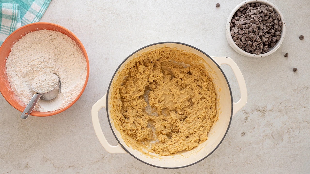gradually adding flour into the butter mixture