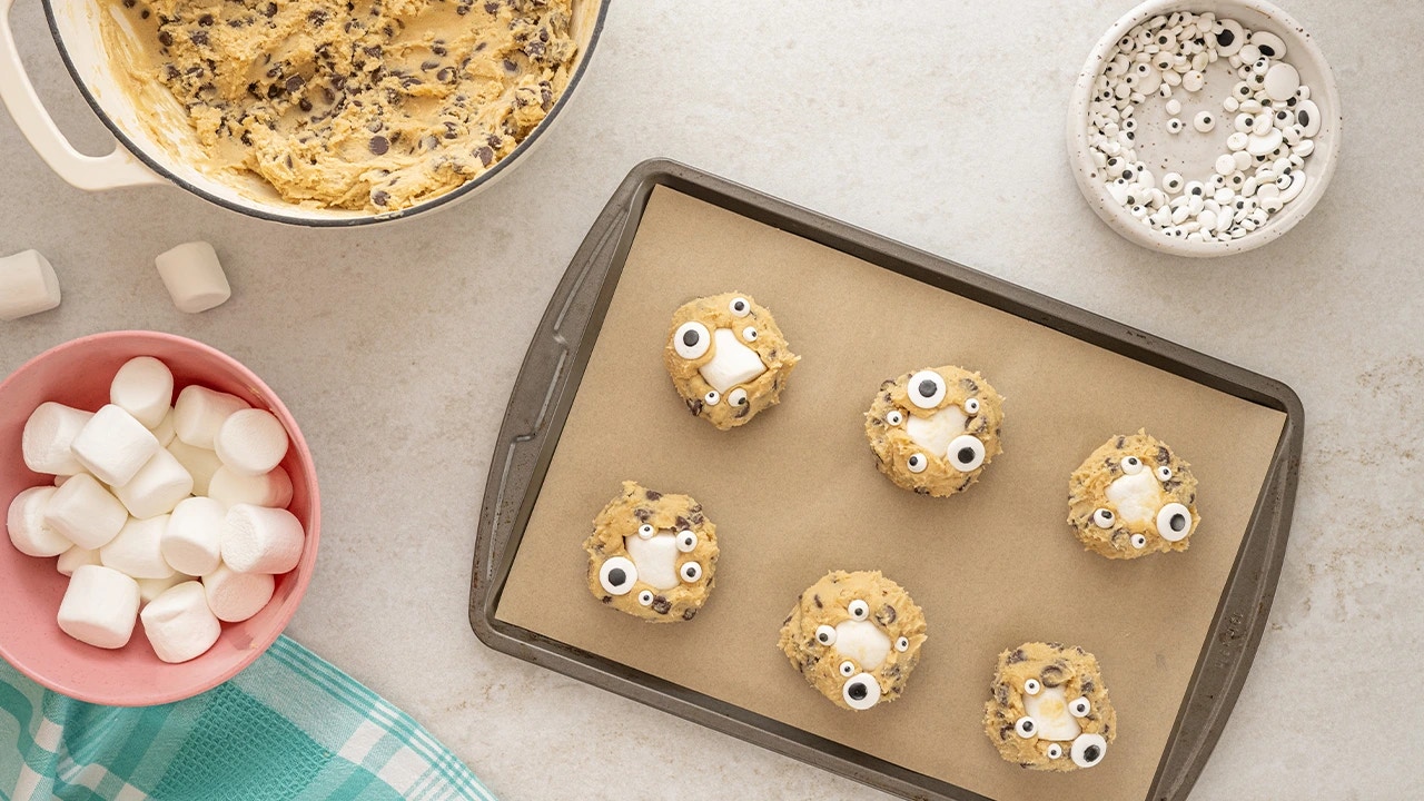 forming cookies and placing them onto the baking sheet