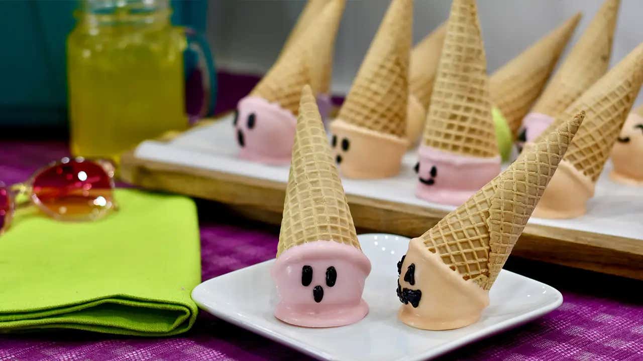 plate of pink and orange summerween ice cream cone cake pops ready to serve