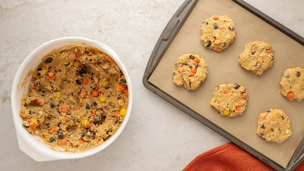 cookie dough portioned out onto baking sheet