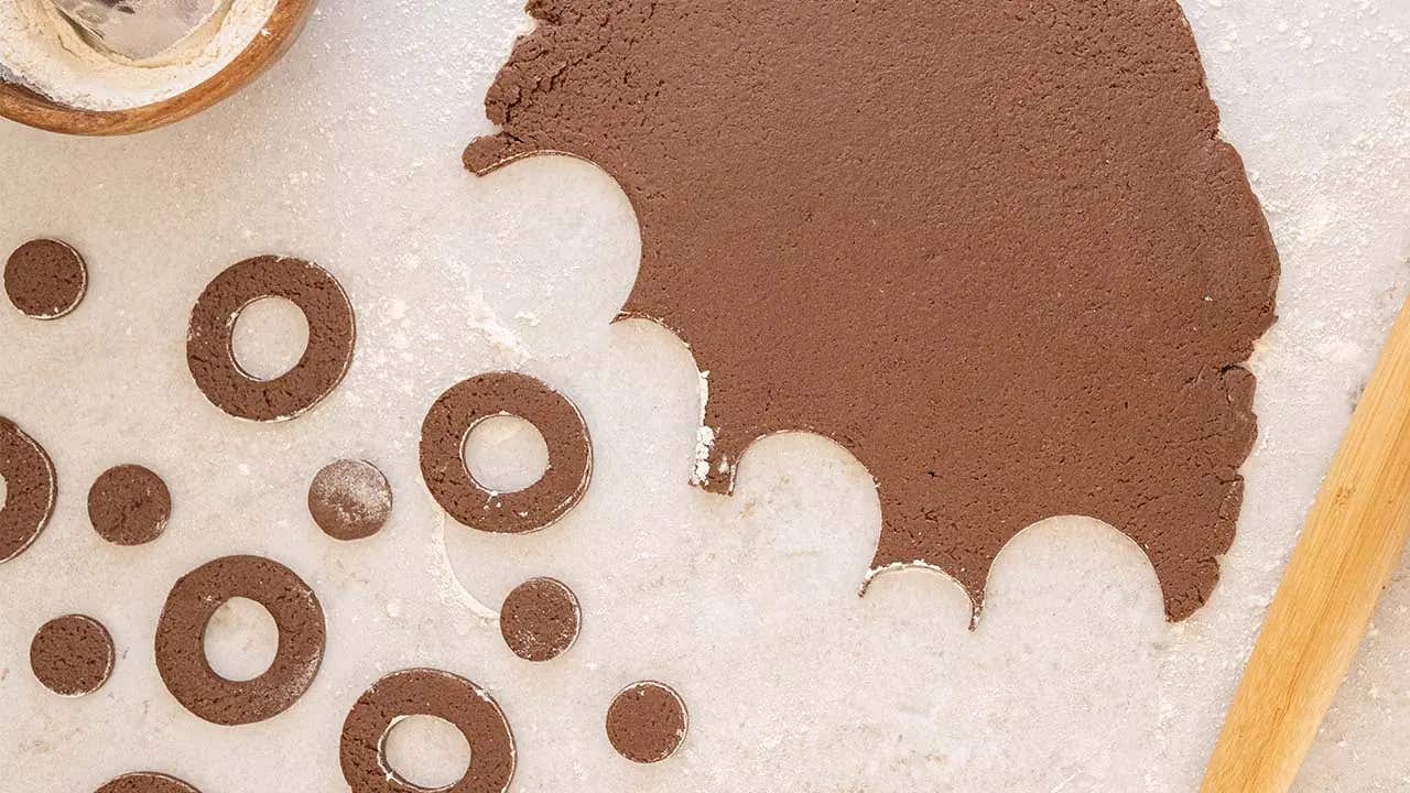 chocolate dough cut into doughnut rings