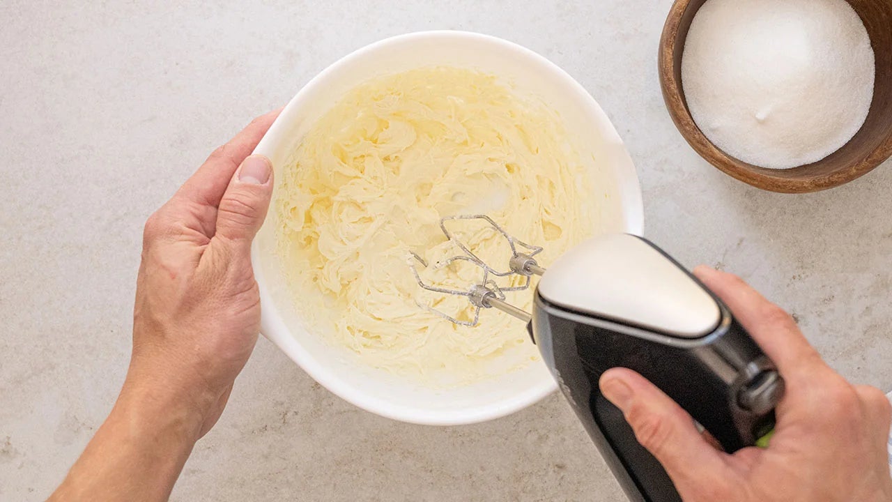 butter and sugar beaten with hand mixer in mixing bowl