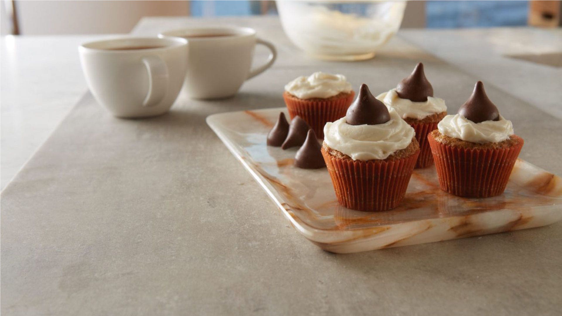 Hershey's KISSES With Almonds topped mini carrot cupcakes