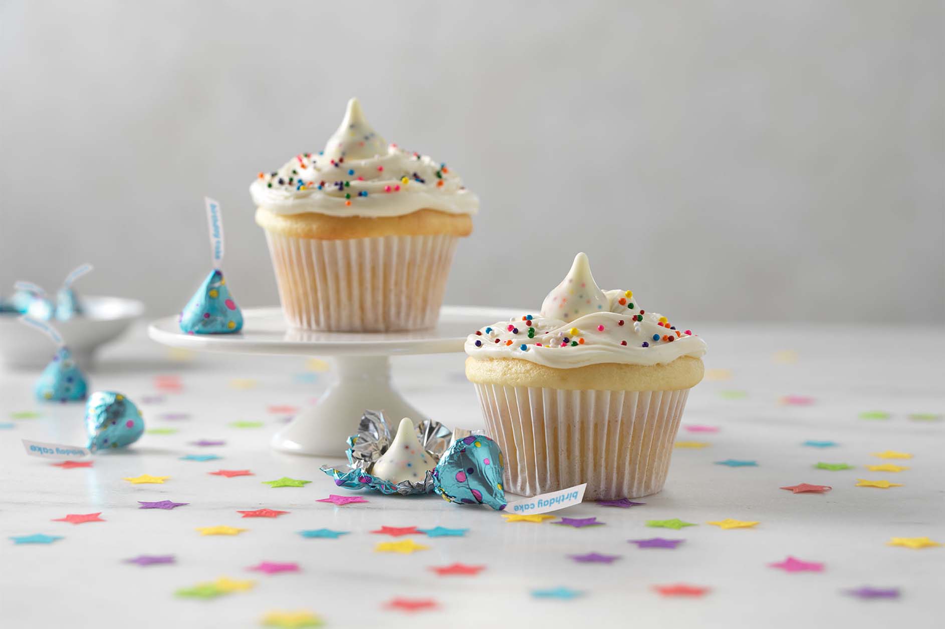 Two birthday cupcakes and some Hershey's Kisses