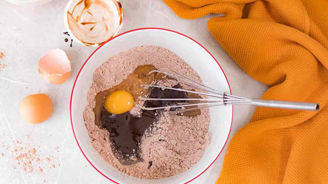 Brownie powder with eggs in a bowl