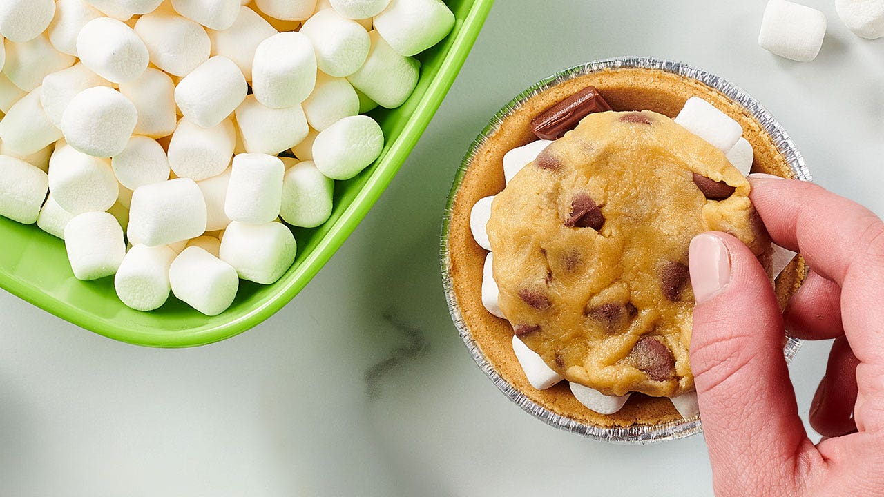 topping the mini pie shell with cookie dough