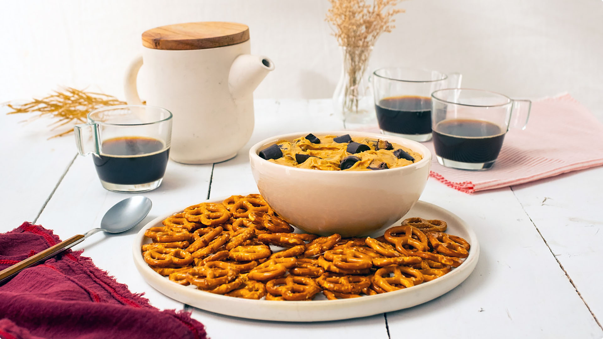 bowl of rolo dark chocolate salted caramel dip served with pretzels