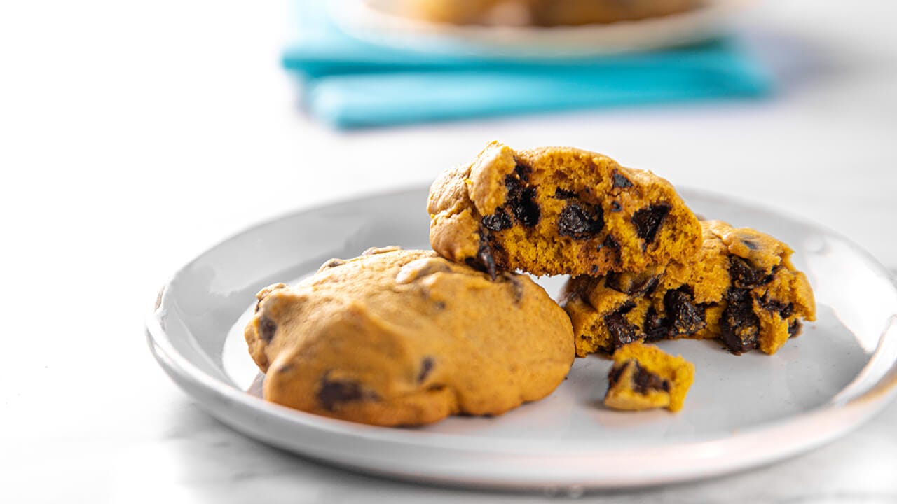 plate of freshly bakes pumpkin chocolate chip cookies