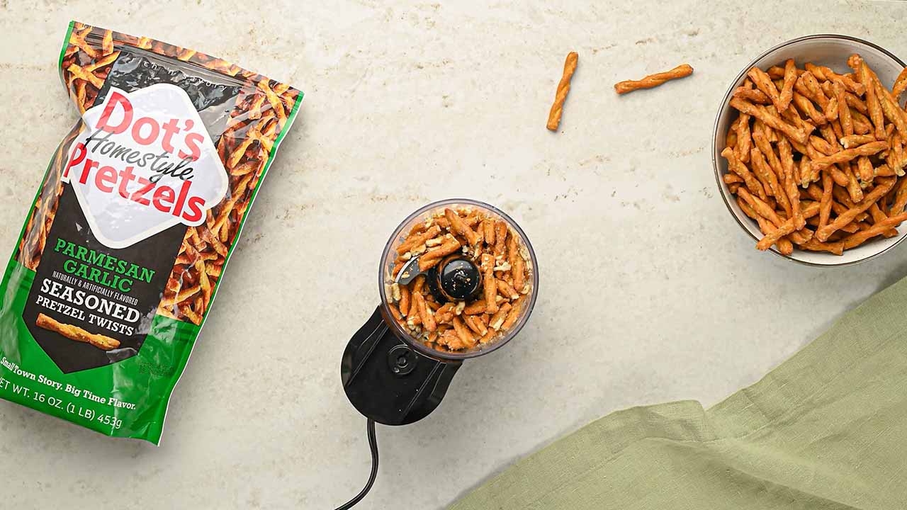 adding dots pretzels pieces into food processor