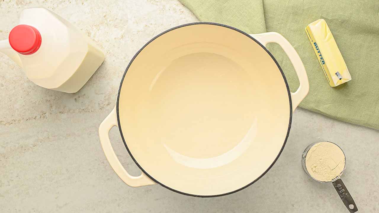 preparing butter for melting in a large pot