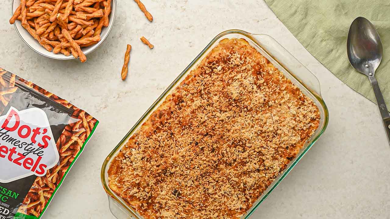 removing the baking dish from the oven and beginning to serve