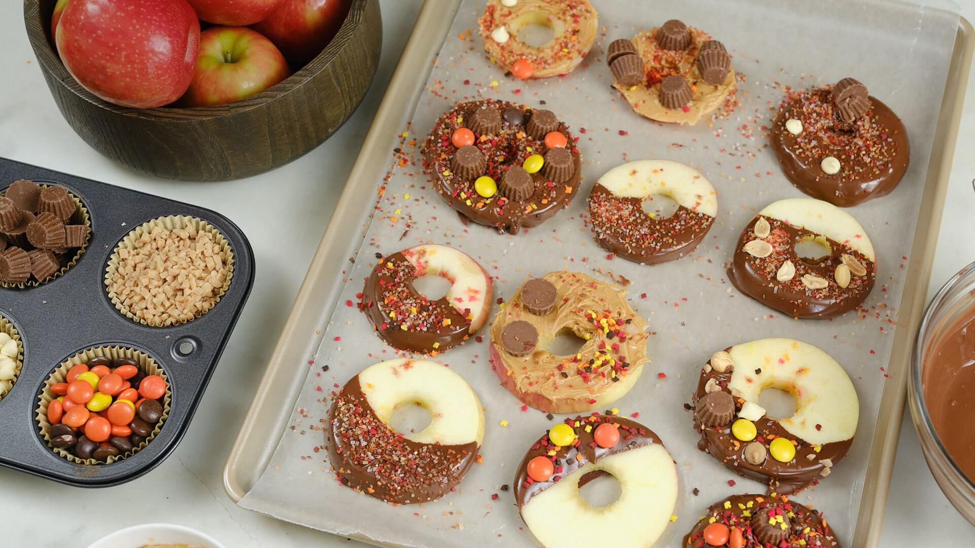 tray of chocolate dipped apple donutes