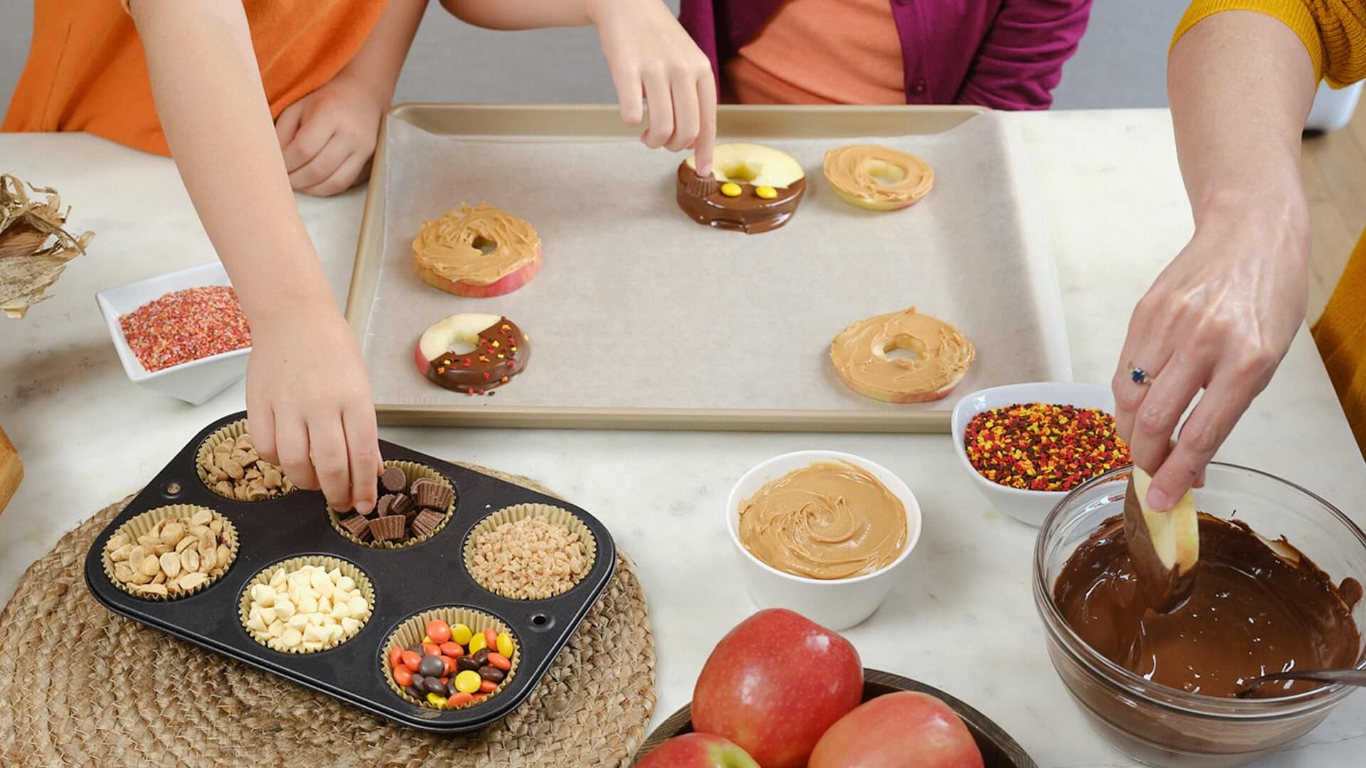 preparing chocolate dipped donuts