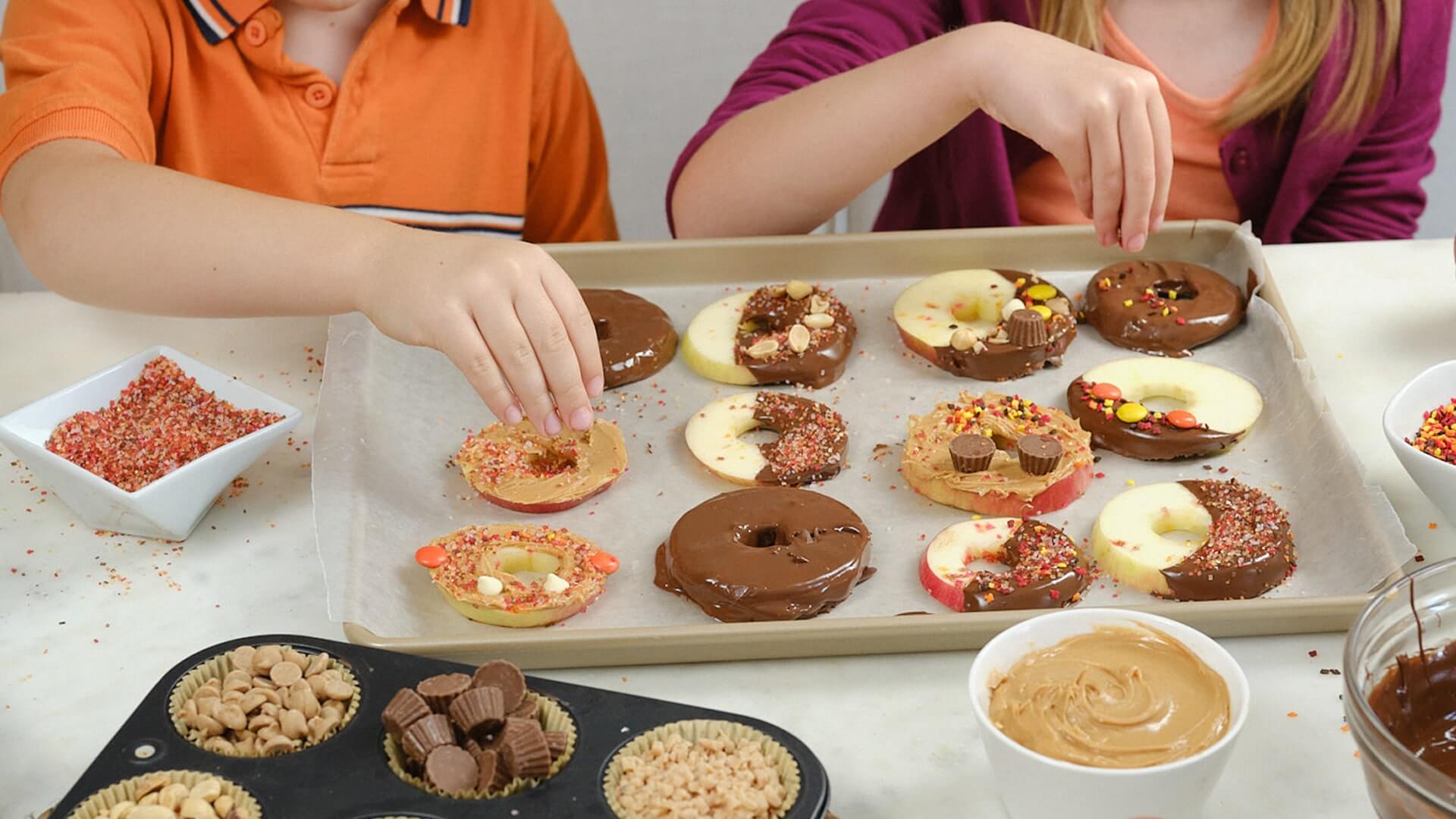 decorating chocolate dipped apple donuts