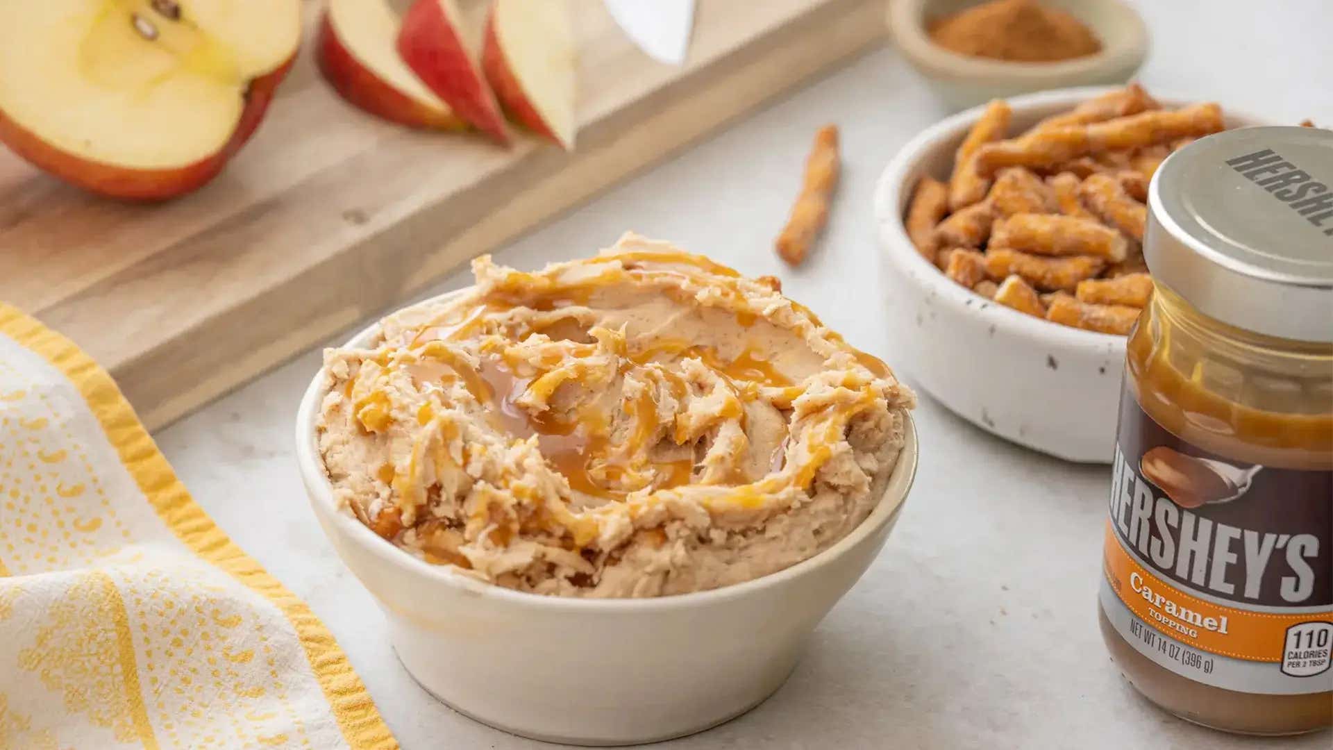 bowl of dots cinnamon caramel pretzel dip paired with pretzels for dipping