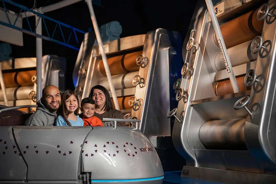 family experiencing hersheys chocolate tour ride at chocolate world
