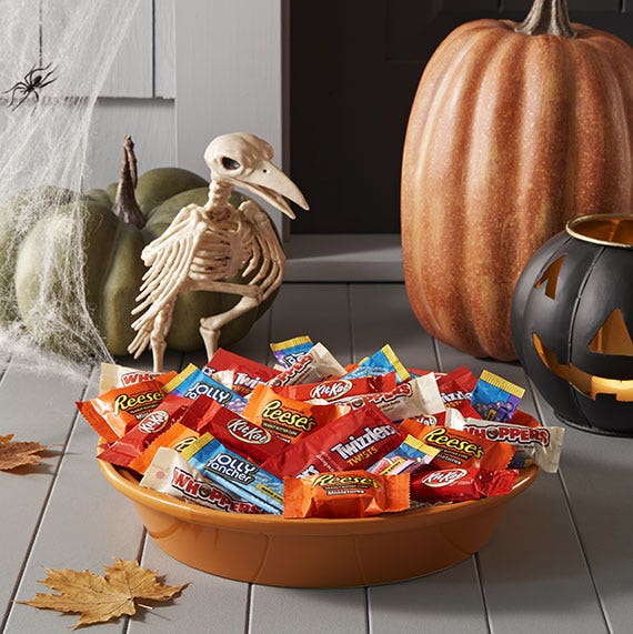 hershey candy in a bowl along with halloween decoration