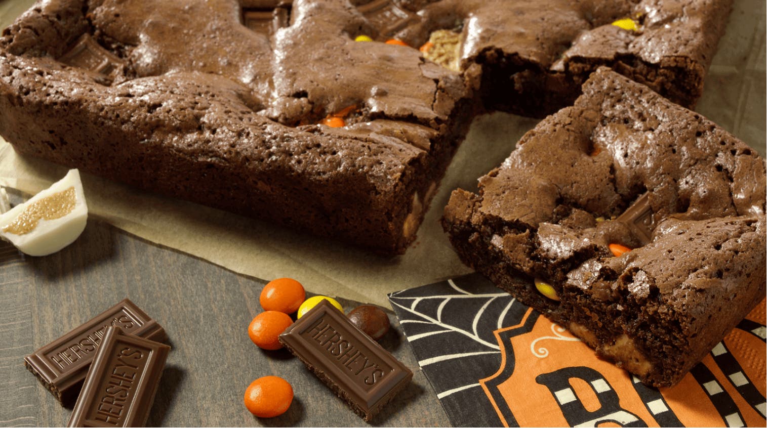Brownies with reese's, hershey chocolate bar pieces, and reese's pieces baked into them