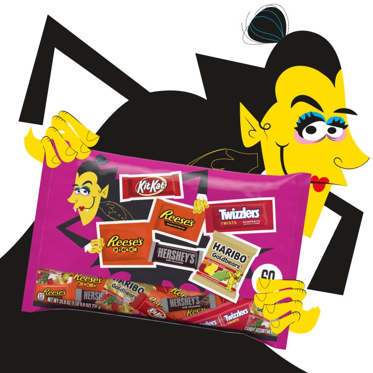 vampire woman holding a halloween candy assortment bag