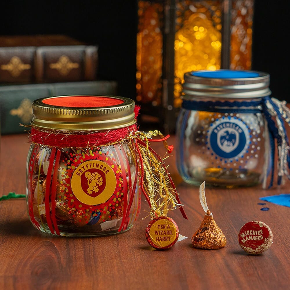 harry potter hogwarts house themed candy jars filled with hersheys kisses