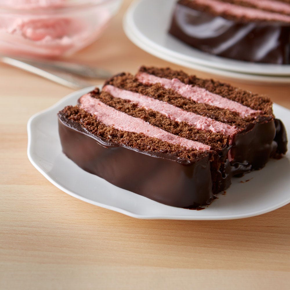 slice of hersheys chocolate strawberry whipped cream cake