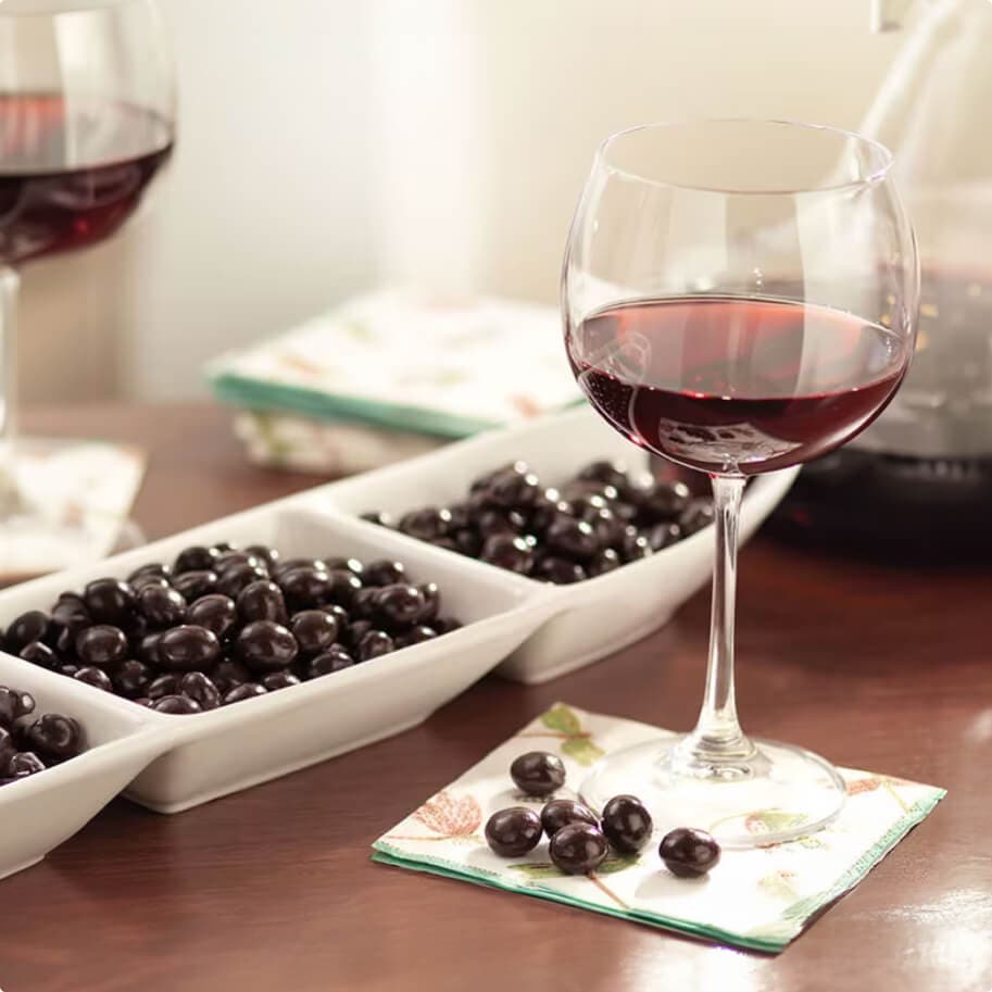 wine glasses and chocolates on a table