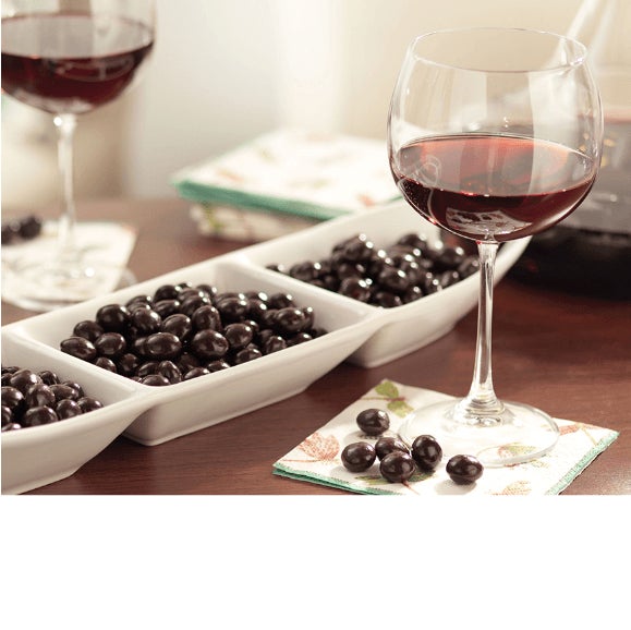 wine glasses and chocolates on a table