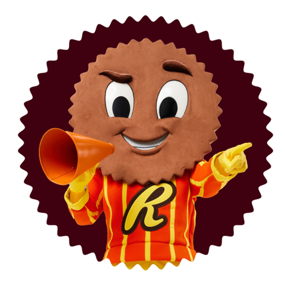 cuppy mascot holding megaphone inside reeses cup
