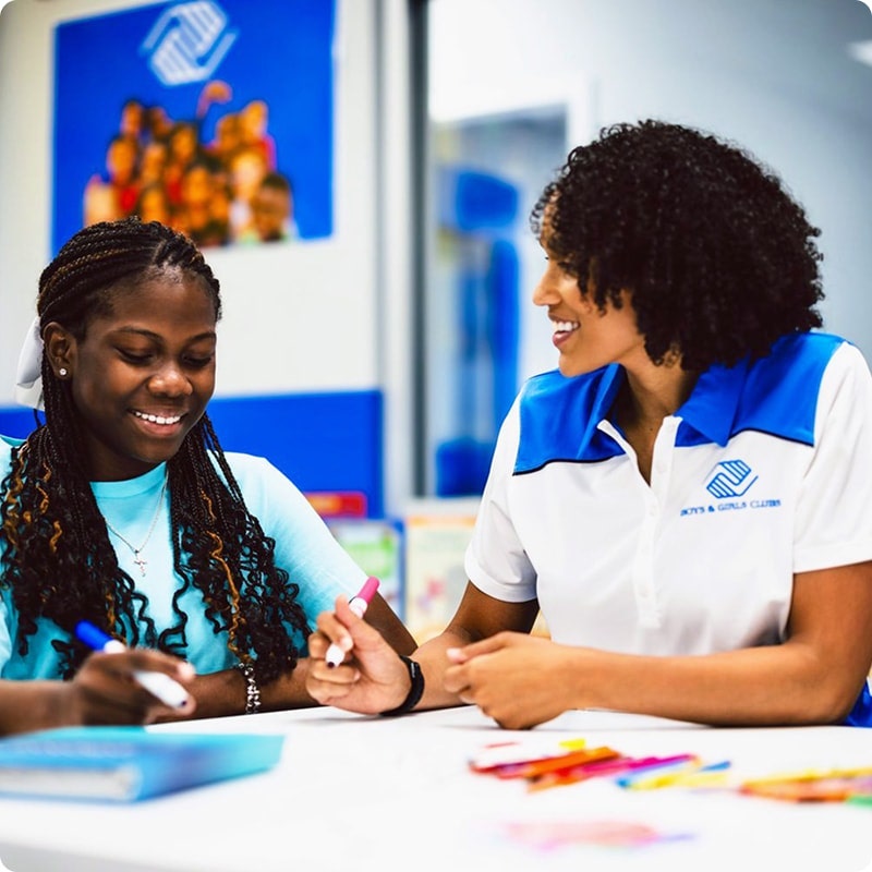 Child and adult working together on a project