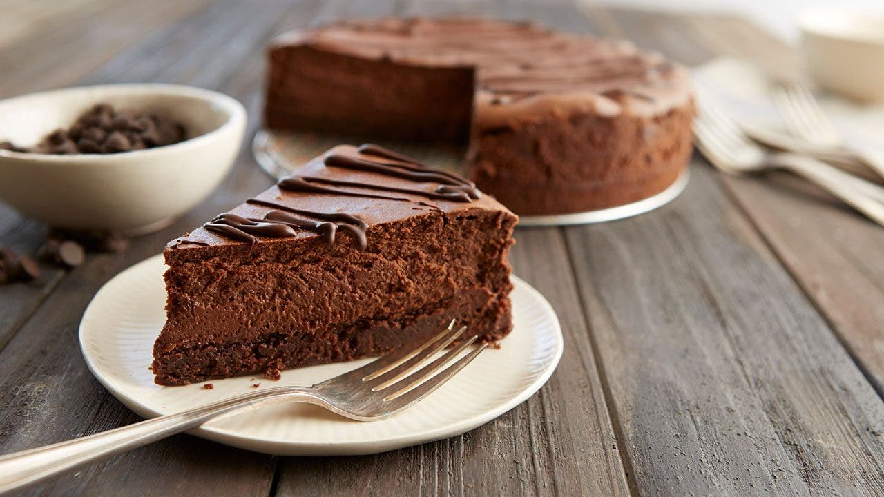 Hersheys Special Dark Chocolate Truffle Brownie Cheesecake on a white plate