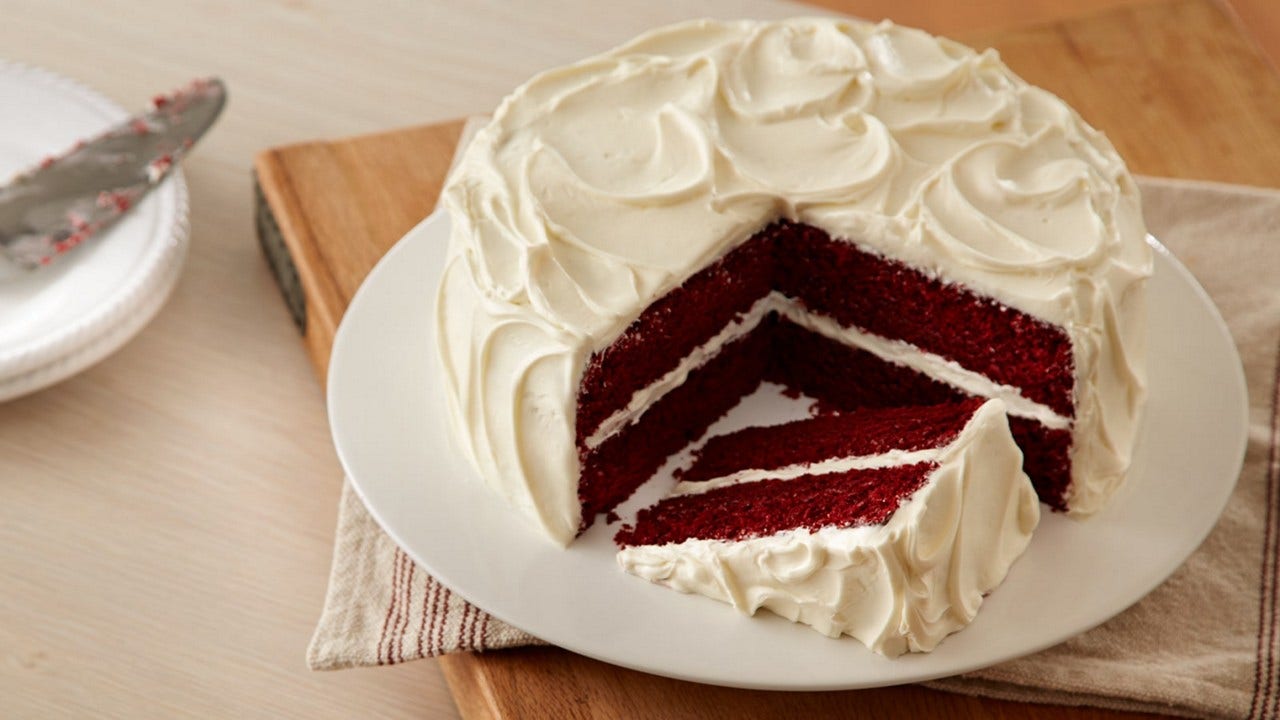 red velvet cake with slice taken from it