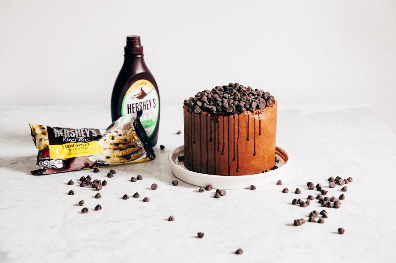 decorated cake with chocolate syrup and chocolate chips