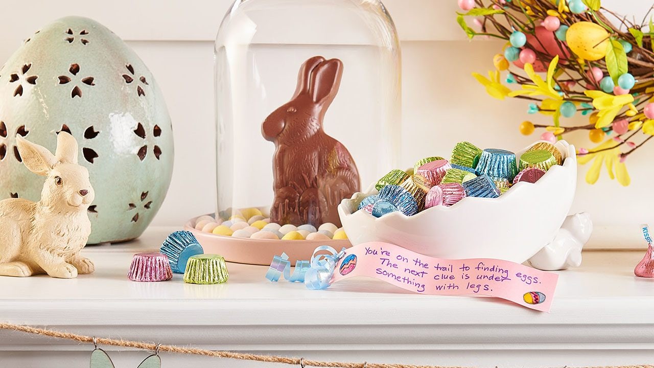 fireplace mantle topped with easter candy and decorations