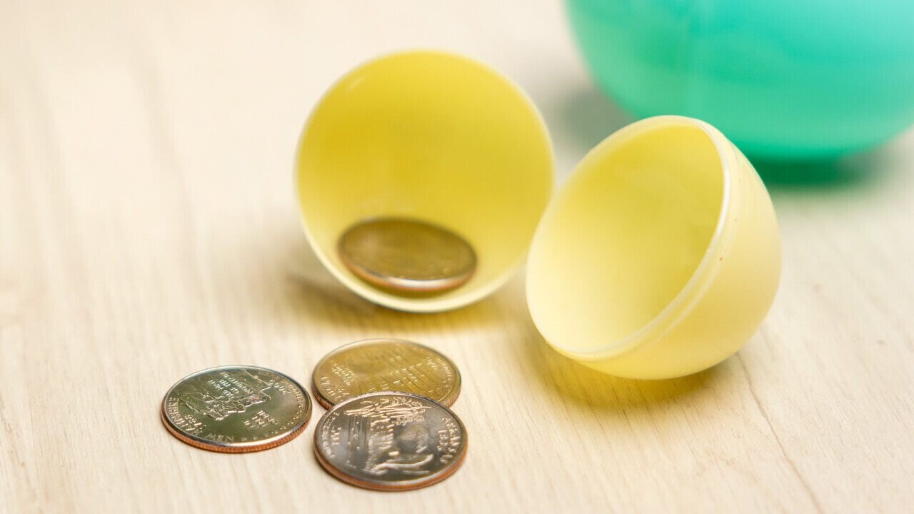 plastic easter egg filled with coins
