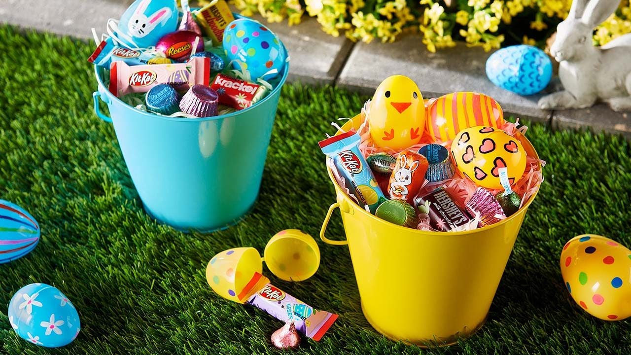 buckets filled with hersheys easter candy and plastic easter eggs