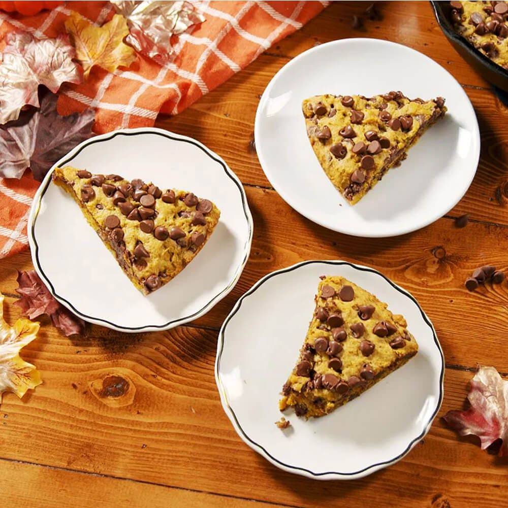 3 plated slices of a chocolate chip pumpkin cookie skillet