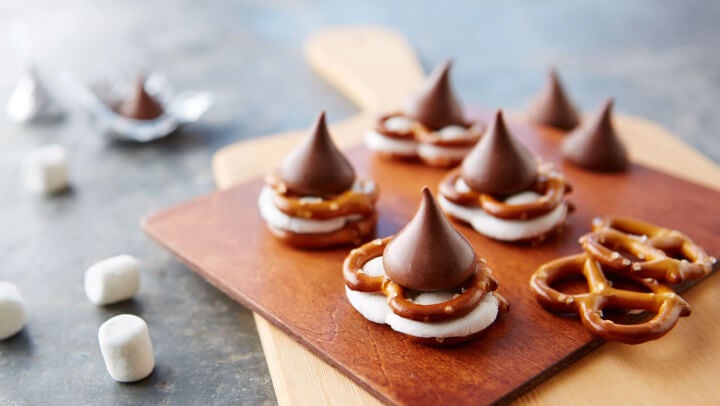 serving tray of hersheys kisses pretzel smores