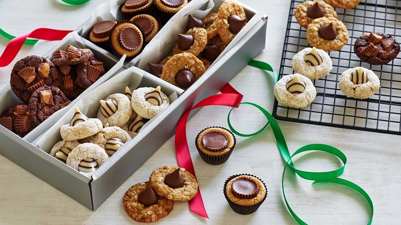 gift box filled with assorted Christmas cookies and blossoms