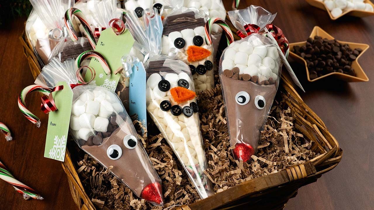 holiday character themed piping bags filled with hot chocolate mix ingredients