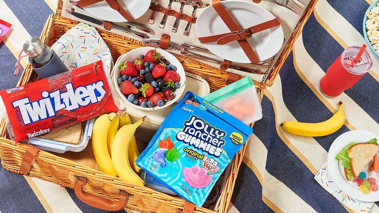 picnic basket filled with assorted foods and hersheys candy