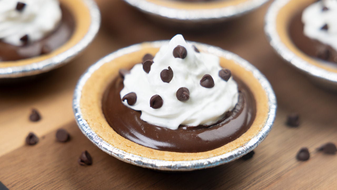tray of mini chocolate pies topped with mini chocolate chips