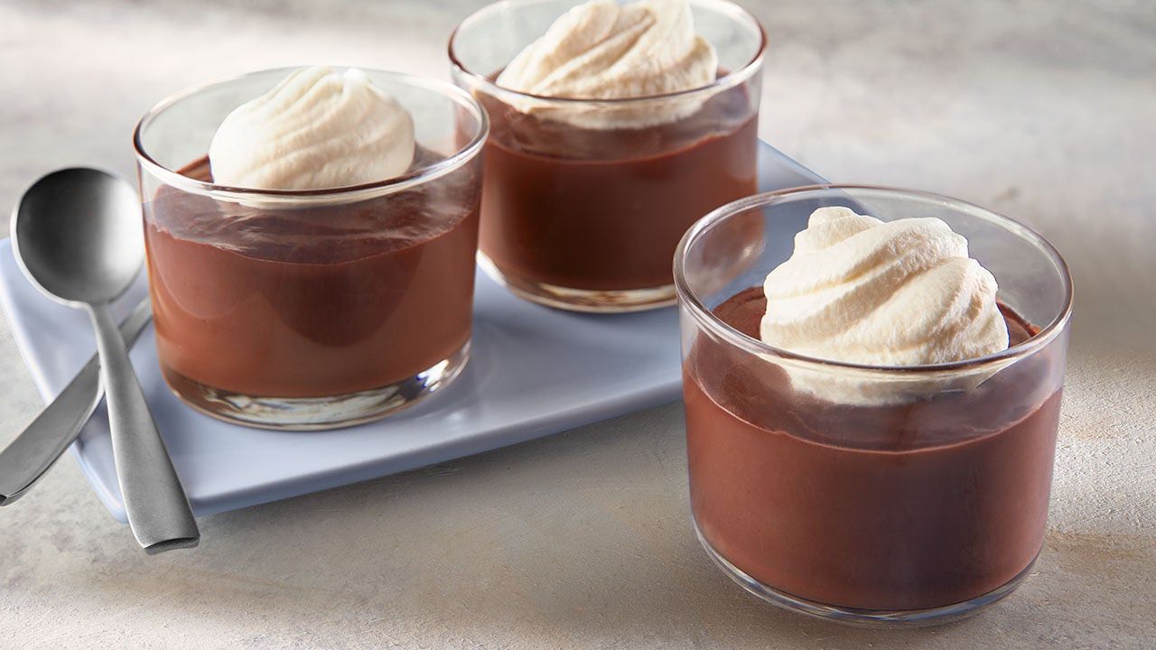 three glass cups of creamy chocolate pudding