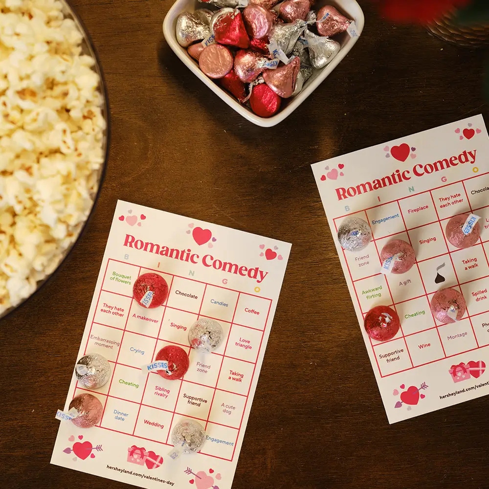 rom com movie bingo with wine, chocolate, and popcorn