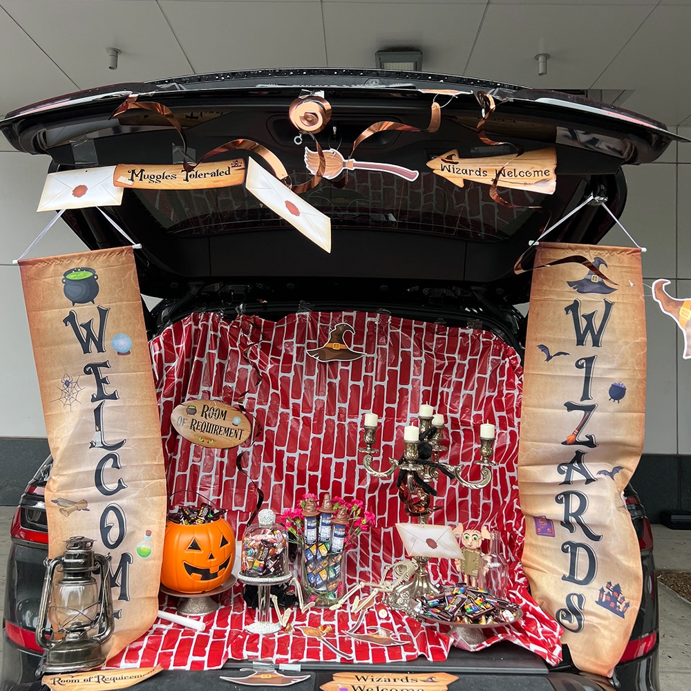car trunk decorated to look like a witches and wizards theme
