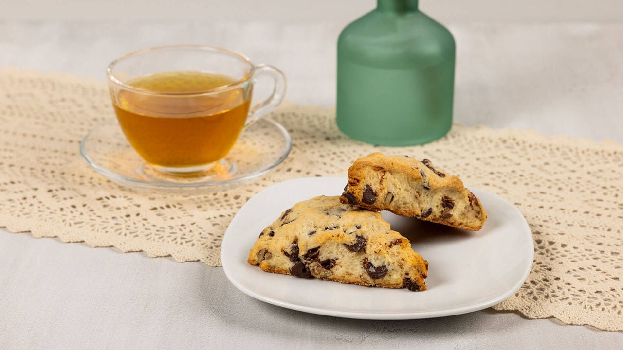 plate of special dark chocolate chip scones paired with jasmine tea