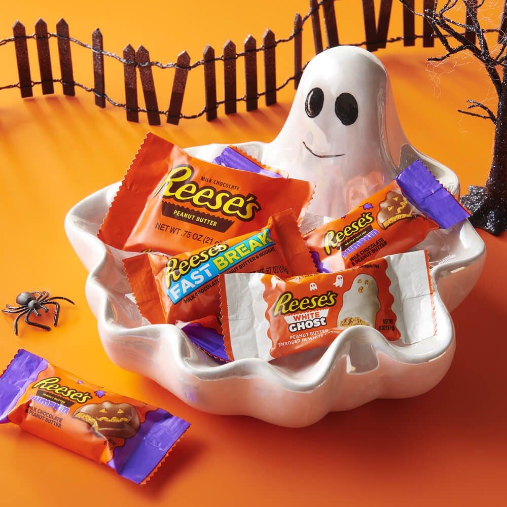 assorted reeses candy inside ghost themed bowl