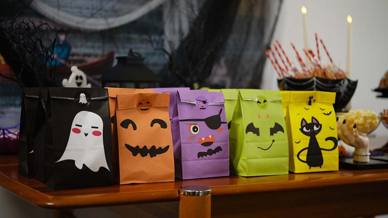 table topped with assorted halloween themed treat bags