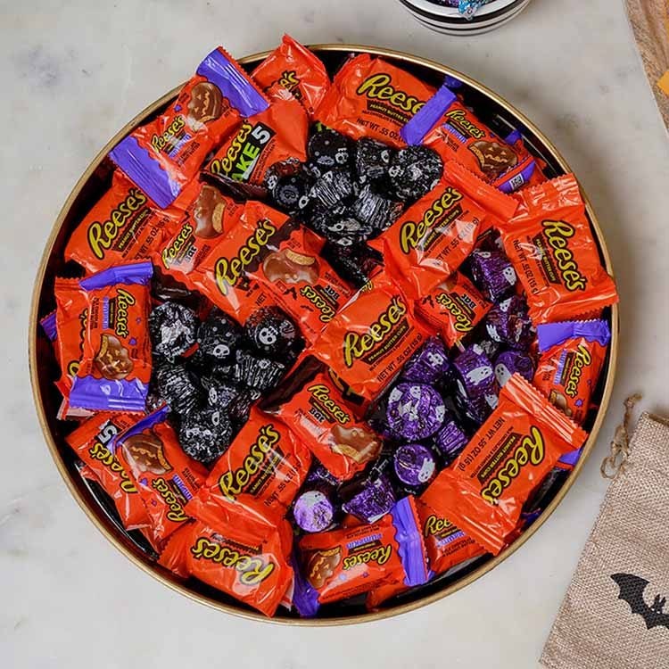 candy dish with assorted hersheys candies arranged in shape of jack o lantern
